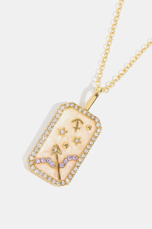 Zodiac sign necklace with Sagittarius symbol, stars, and crystals on a 14K gold-plated chain.