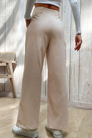 Beige tailored seam wide-leg trousers with pockets, styled casually.
