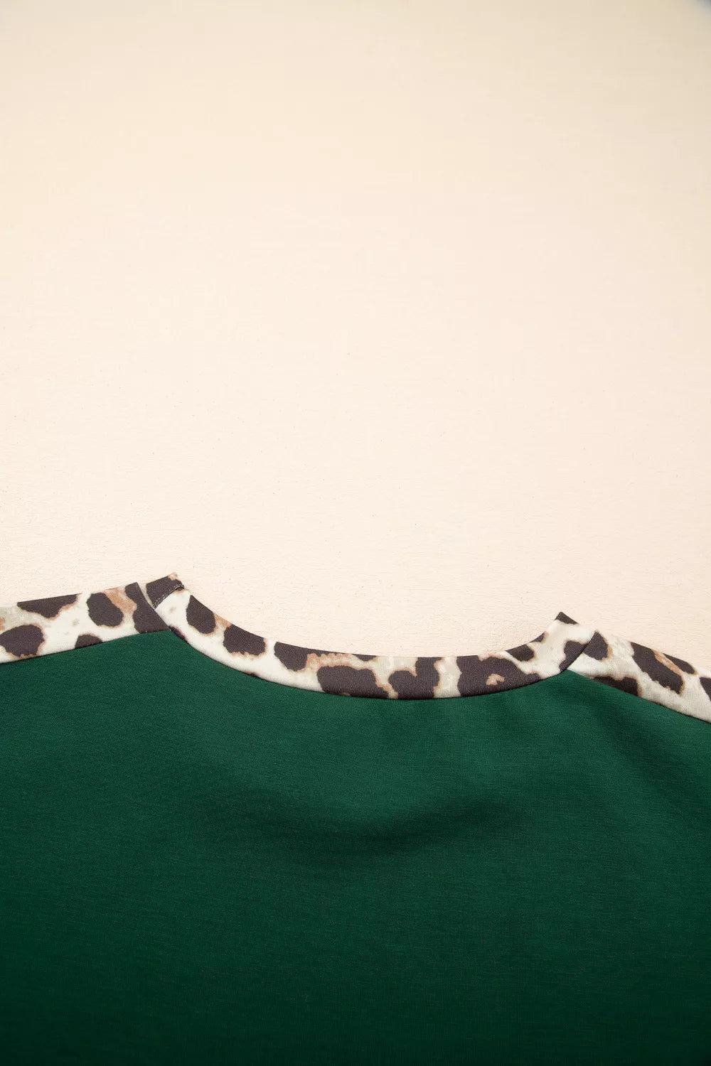 Relaxed fit tee in dark green with leopard print neckline detail.