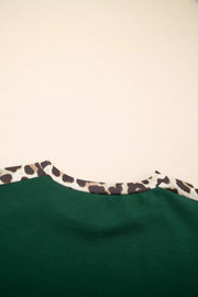 Relaxed fit tee in dark green with leopard print neckline detail.