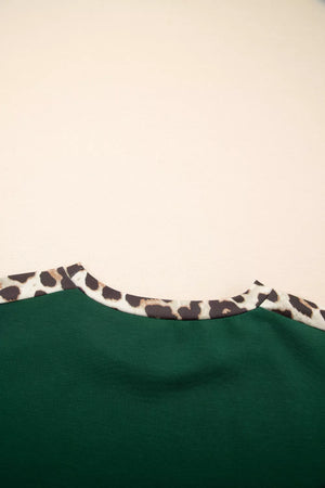 Relaxed fit tee in dark green with leopard print neckline detail.