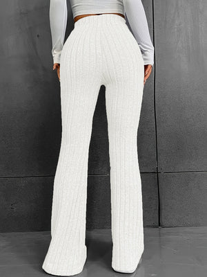 White ribbed flare trousers with a high waist and polyester fabric.