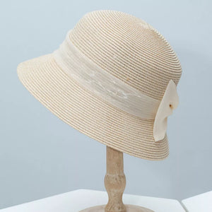 Beige cloche sun hat with ribbon detail and bow