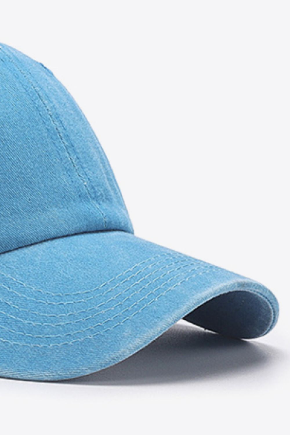 Washed cotton baseball cap in Sky Blue with stitched details on the brim.