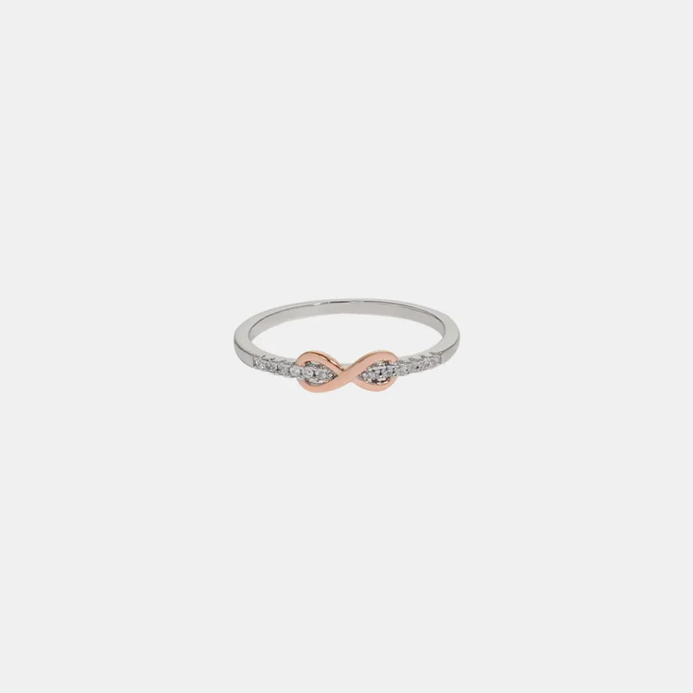 Infinity knot ring with rose gold and diamond accents.