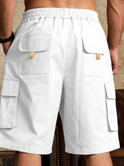 White cargo shorts with drawstring waist and multiple flap pockets.