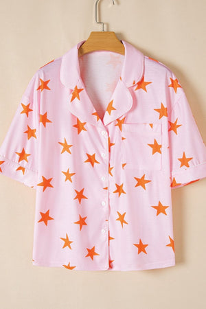 Pink pajama top with orange stars, button front, collar, and chest pocket.
