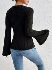 Black ribbed sweater with flared sleeves and a crew neck.