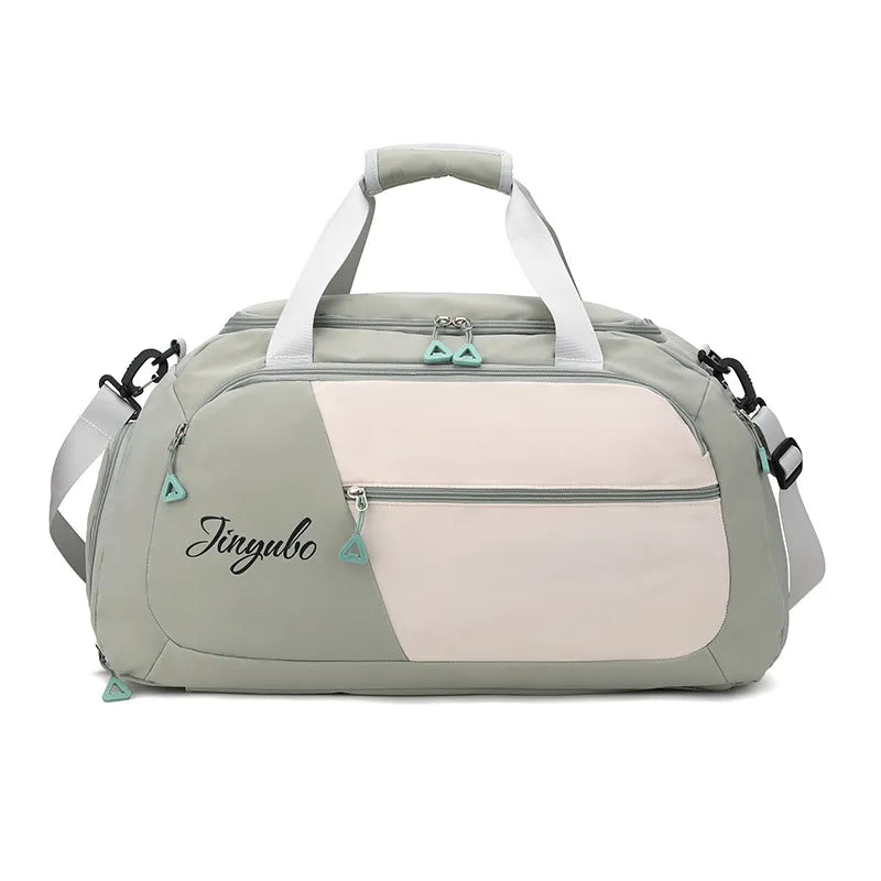 Colorblock travel duffel bag in Sage with a pale blush front panel and logo detail.