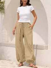 Khaki relaxed harem pants with drawstring and contrast stitching detail.