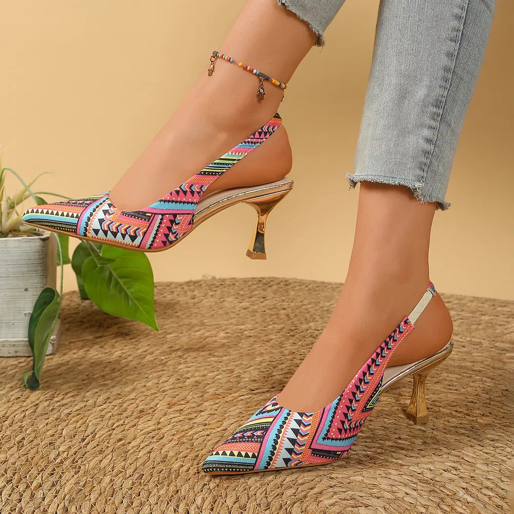 Geometric patterned slingback kitten heels in multicolor with pointed toe and metallic heel.