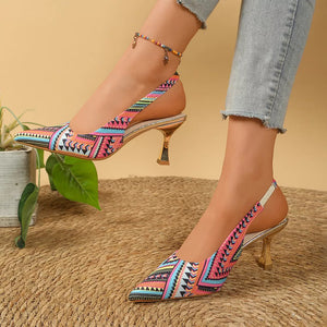 Geometric patterned slingback kitten heels in multicolor with pointed toe and metallic heel.