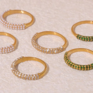 Gold band rings with pavé white or dark green zirconia stones