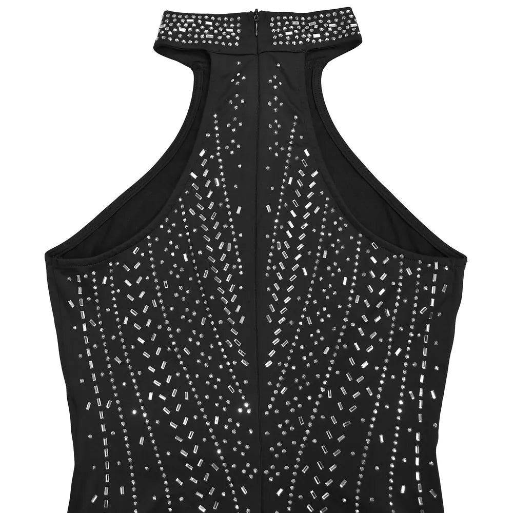 Black halter neck romper with allover rhinestone embellishments and a high neckline.