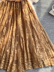 Brown lace dress with intricate floral pattern and scalloped hem detail.