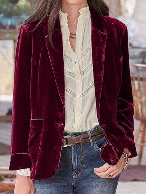 Burgundy velvet blazer with rolled cuff detail and button closure, styled with a white lace-trimmed blouse.