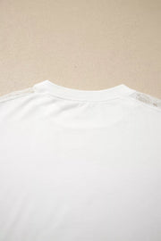 White long sleeve shirt with delicate lace shoulder detail and crew neckline.