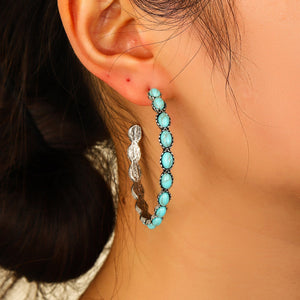 Textured turquoise stone hoop earrings with silver-tone metal and oval stones.