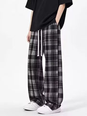 Plaid drawstring relaxed fit sweatpants in black with white drawstring.
