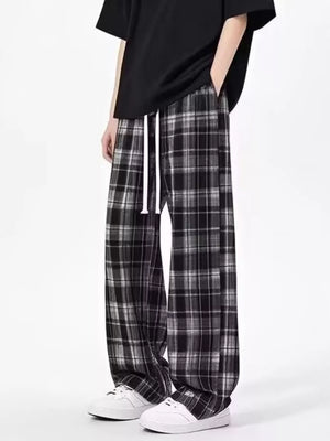 Plaid drawstring relaxed fit sweatpants in black with white drawstring.