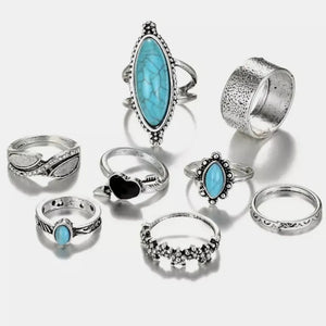 Bohemian silver rings with assorted turquoise stones and designs.