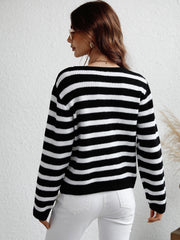 Black and white horizontal stripe knit cardigan with crew neck and long sleeves.