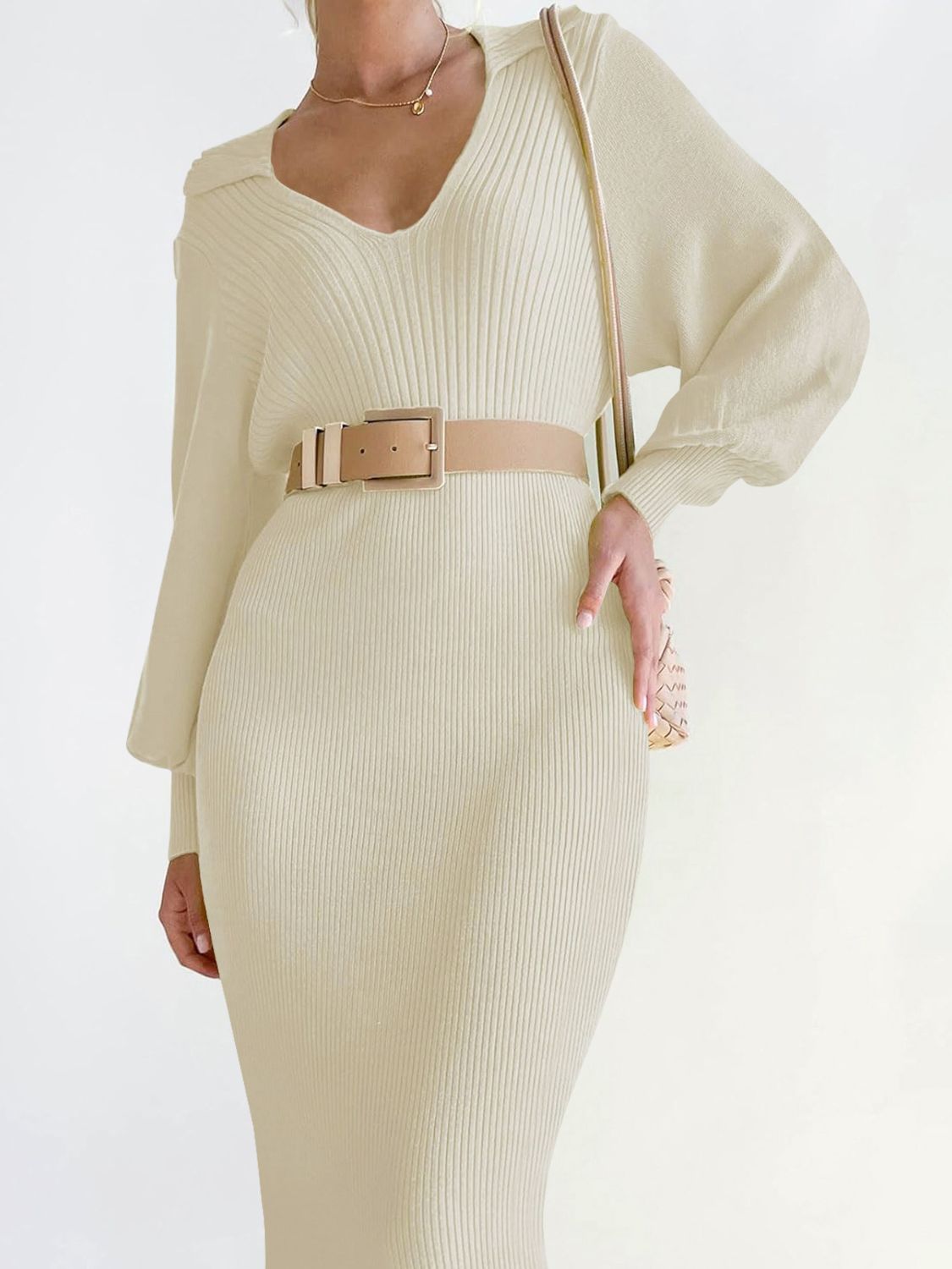 Cream ribbed knit midi dress with V-neck and long sleeves, cinched with a belt.