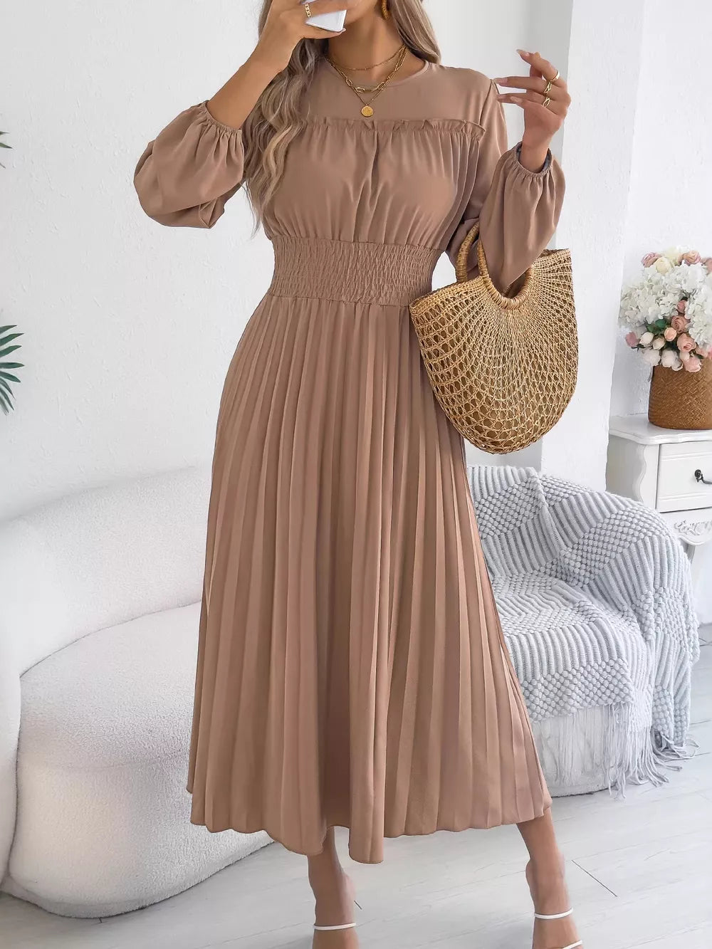 Khaki ruffled smocked waist midi dress with long sleeves and a pleated skirt.