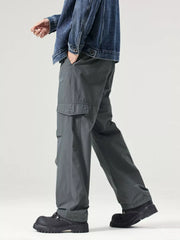 Dark gray utility cargo pants with flap pockets and adjustable details.