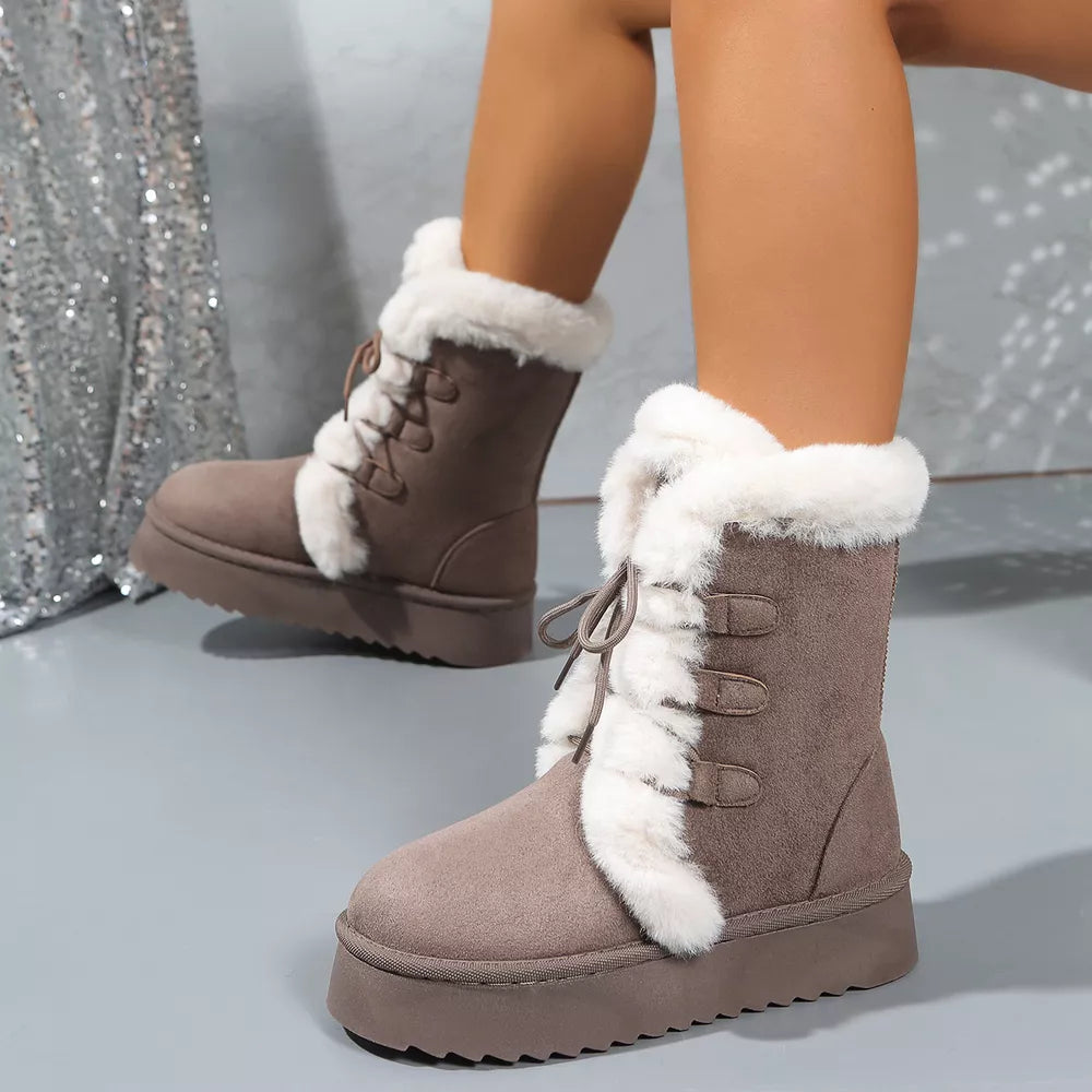 Brown suede lace-up platform boots with white fur trim and lining.