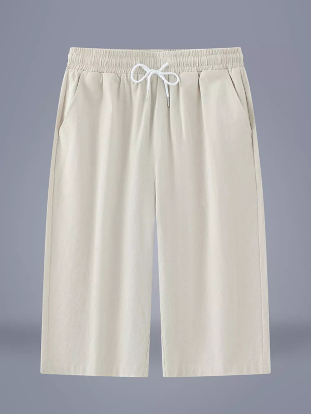 Relaxed ivory cropped sweatpants with drawstring waist and side pockets.
