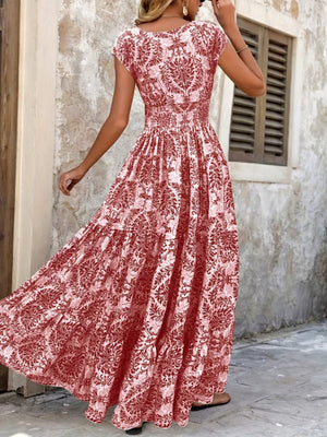 Red damask print maxi dress with cap sleeves and tiered skirt.
