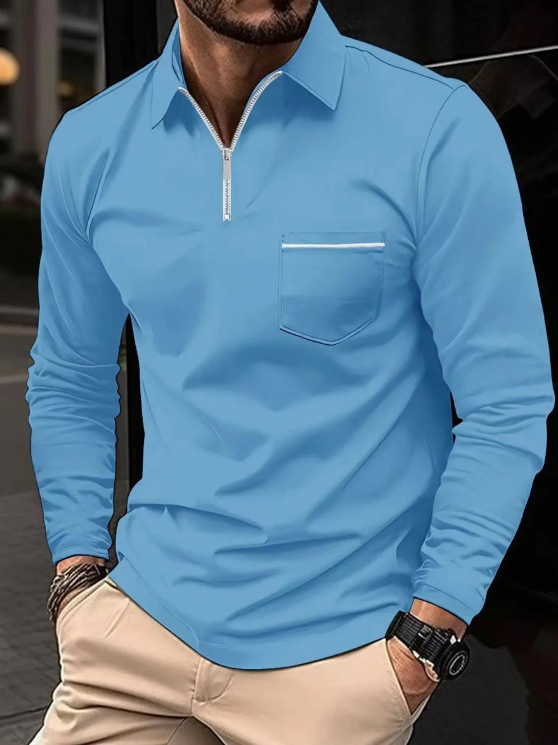 Long sleeve zip-front polo shirt in light blue with contrast pocket detail