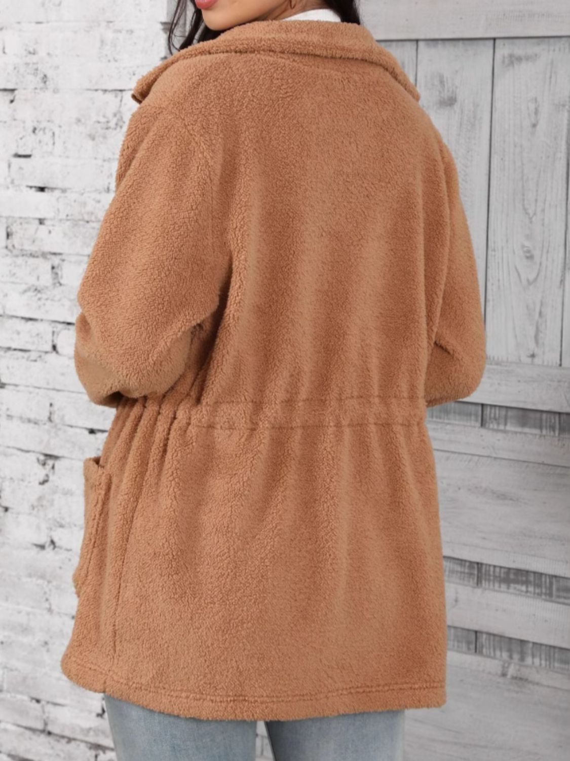 Caramel teddy fleece utility jacket with drawstring waist and pockets.