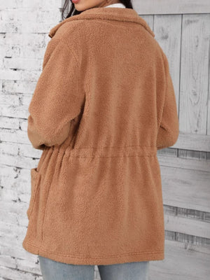 Caramel teddy fleece utility jacket with drawstring waist and pockets.