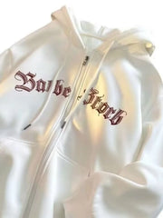 White zip up hoodie with drawstring and gothic text graphic