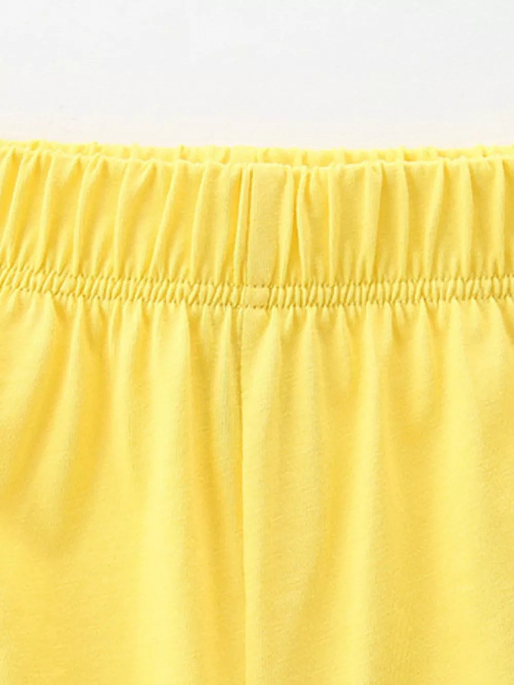 Yellow cotton baby shorts with elastic waistband