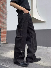 Classic vintage wide leg jeans in dark wash cotton with contrast stitching and multiple pockets.