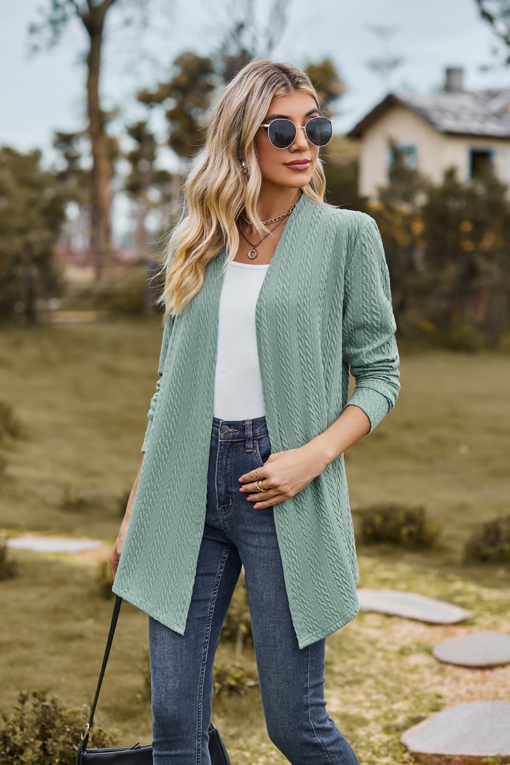 Sage textured knit cardigan with open front and long sleeves.