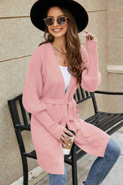 Dusty Pink knit cardigan with puffed sleeves and a tie belt.