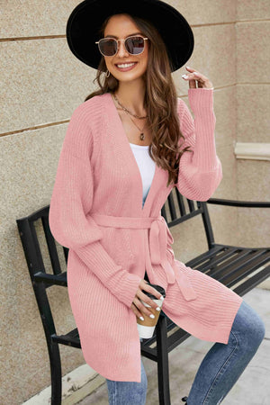 Dusty Pink knit cardigan with puffed sleeves and a tie belt.