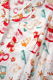 White collared pajama set with festive Christmas print, featuring a chest pocket.