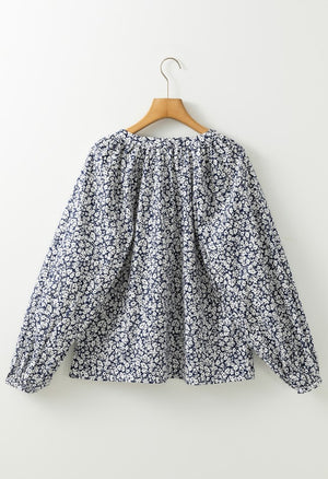 Blouse with allover floral print, gathered neckline and long sleeves.