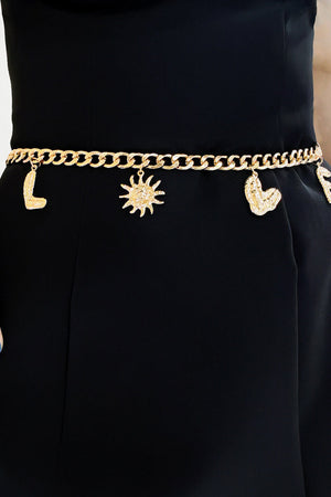 Gold chain belt with celestial charms including sun and heart
