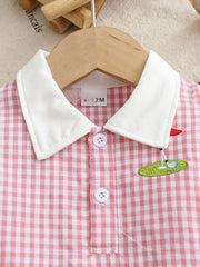 Baby pink gingham polo dress with white collar and golf embroidery detail.