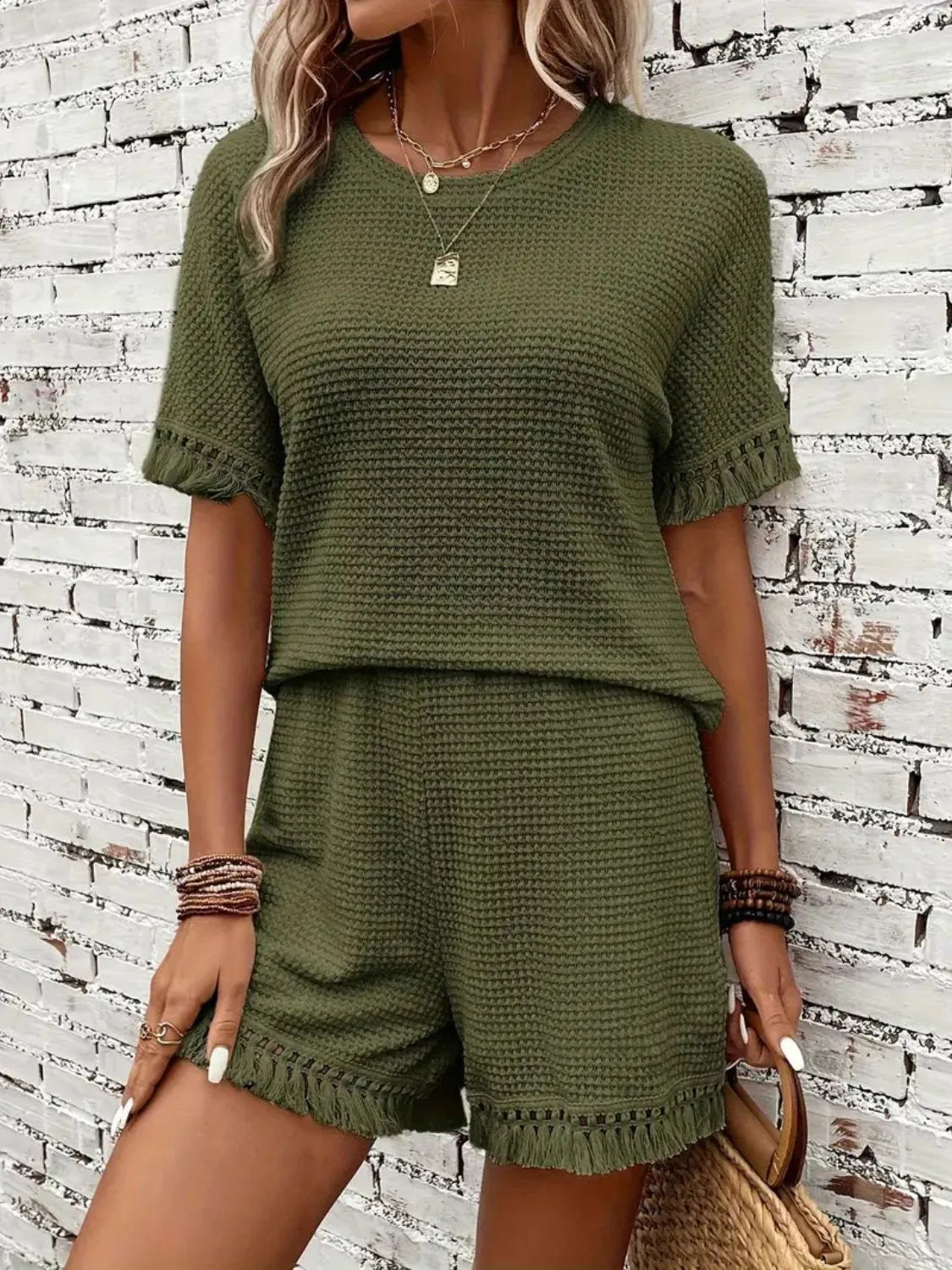 Moss textured knit set with fringe detail on short sleeves and hem.