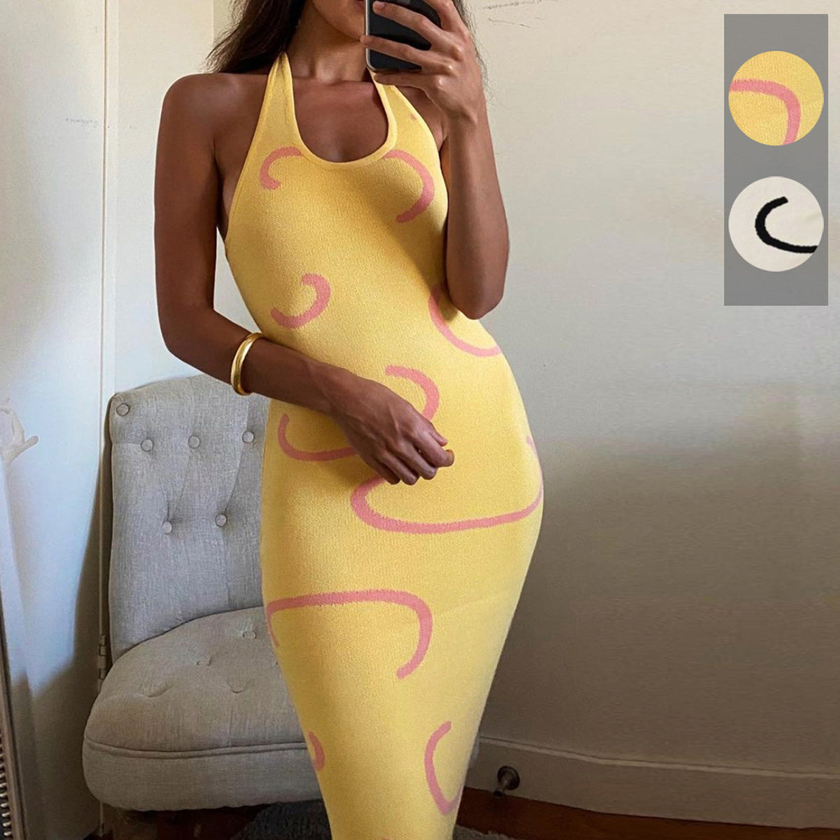 Banana yellow knit midi dress with pink swirl print, halter neck.