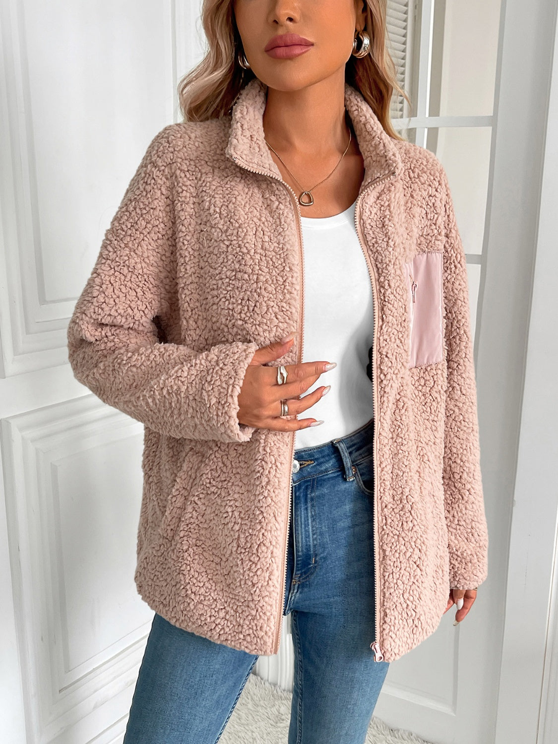 Teddy fleece jacket in watermelon pink with a patch pocket and zip front.