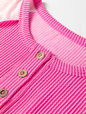 Color block henley t-shirt in fuchsia pink with textured stripes and button detail.