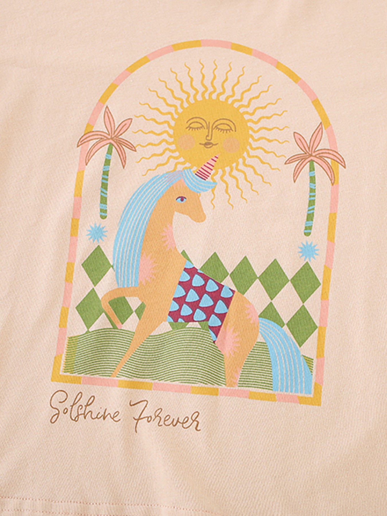 Toddler cotton graphic tee with unicorn, sun, and palm trees, apricot color.